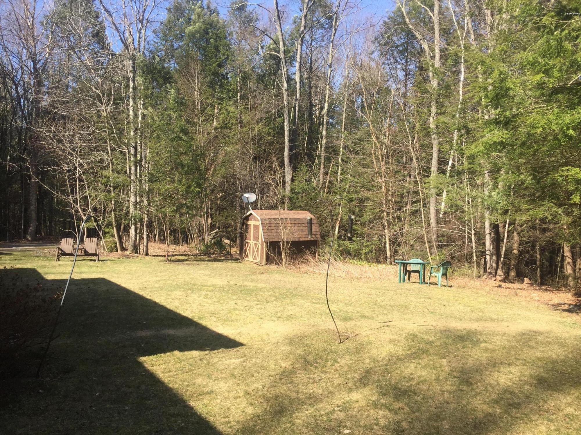 117 Clark Wright Road Middlefield, MA 01050 - Photo 6 of 22 a building with trees in front of it