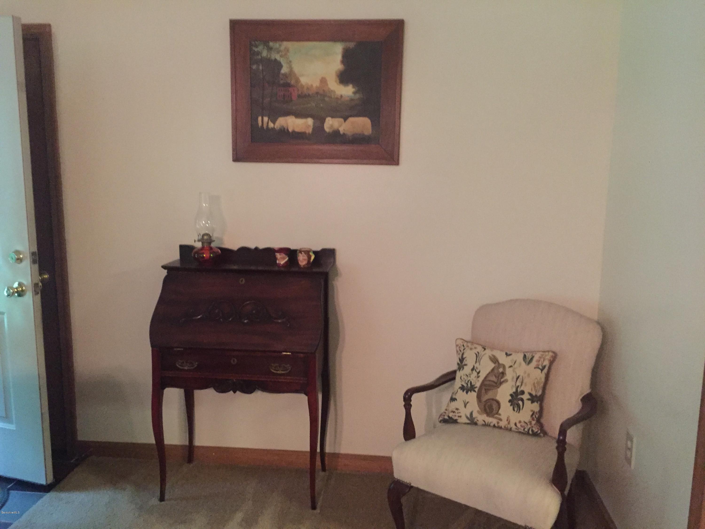 117 Clark Wright Road Middlefield, MA 01050 - Photo 10 of 22 a room with a table and a chair