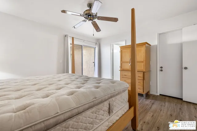 a bedroom with a bed dresser and a window