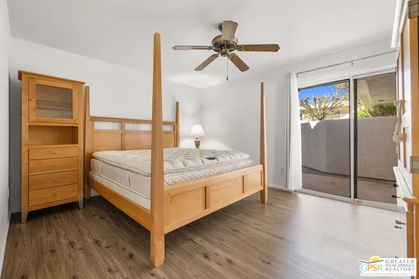 a bedroom with a bed dresser and a window