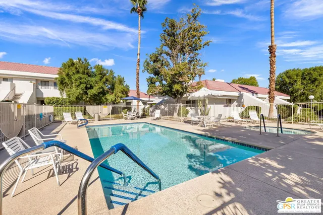 a view of a swimming pool with a patio