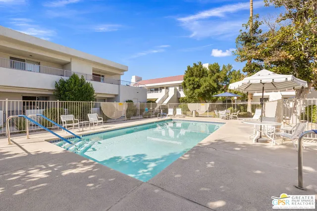 a view of a swimming pool with a patio