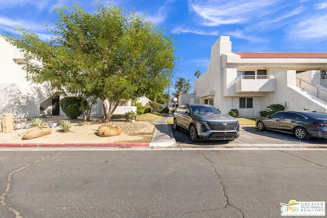 a view of car parked on the side of the road