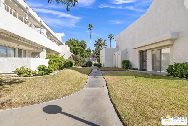 a view of swimming pool with outdoor seating