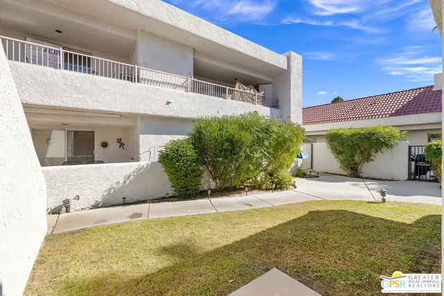 a view of swimming pool with outdoor seating