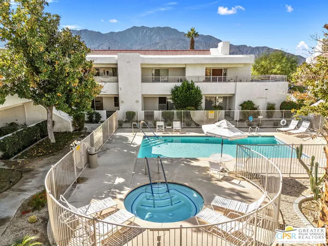 a view of a patio with couches chairs and a fire pit