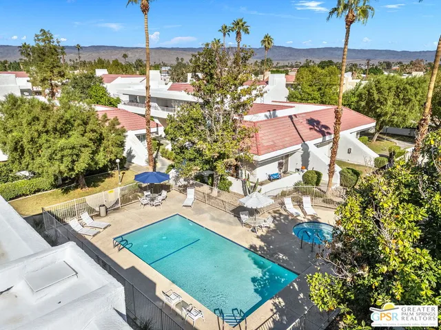 a view of a chairs and table in patio