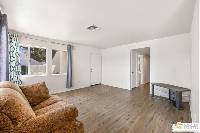 a living room with furniture and a window