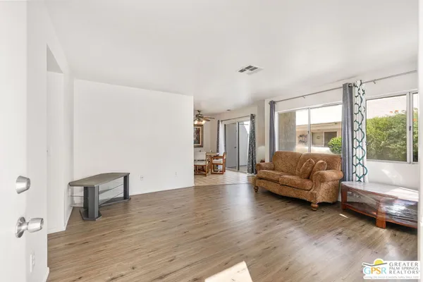 a living room with furniture and a large window