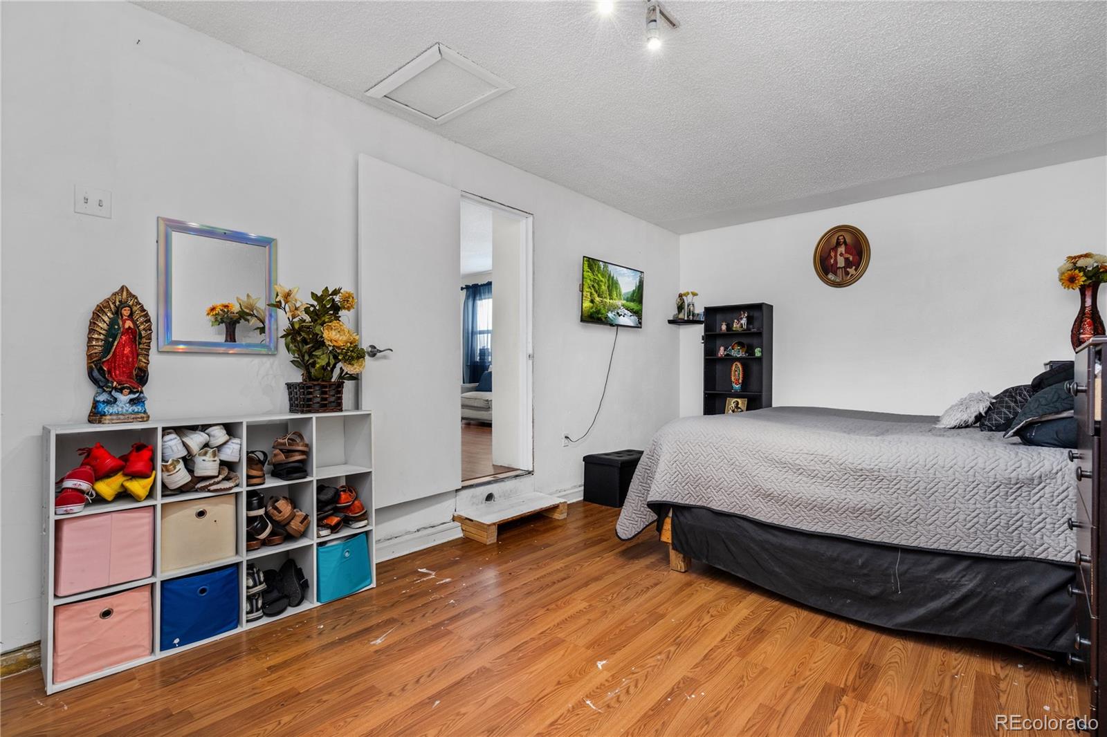 505 26th Avenue Greeley, CO 80634 - Photo 11 of 18 a bedroom with bed and wooden floor