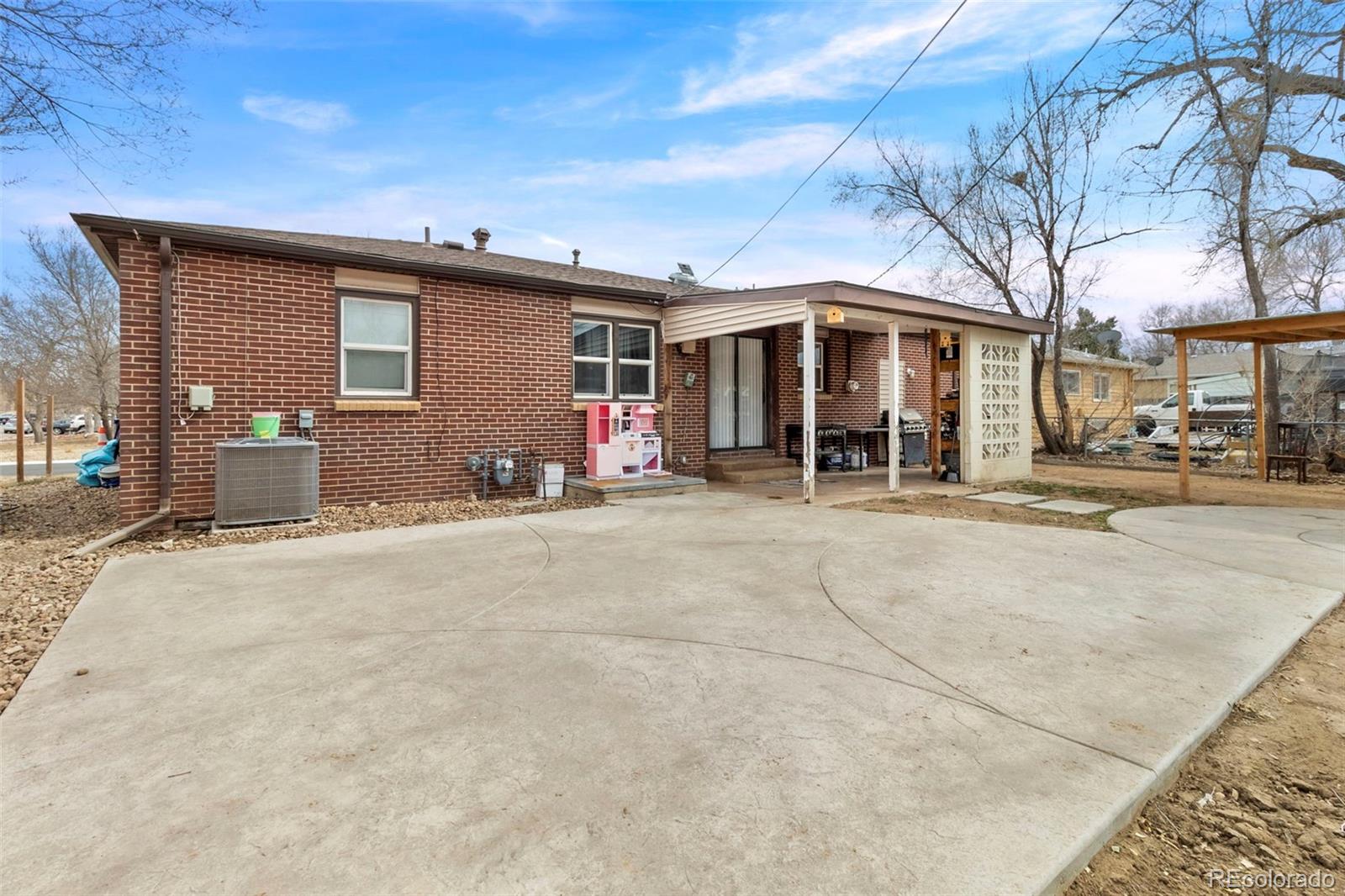 505 26th Avenue Greeley, CO 80634 - Photo 13 of 18 a front view of a house with a yard