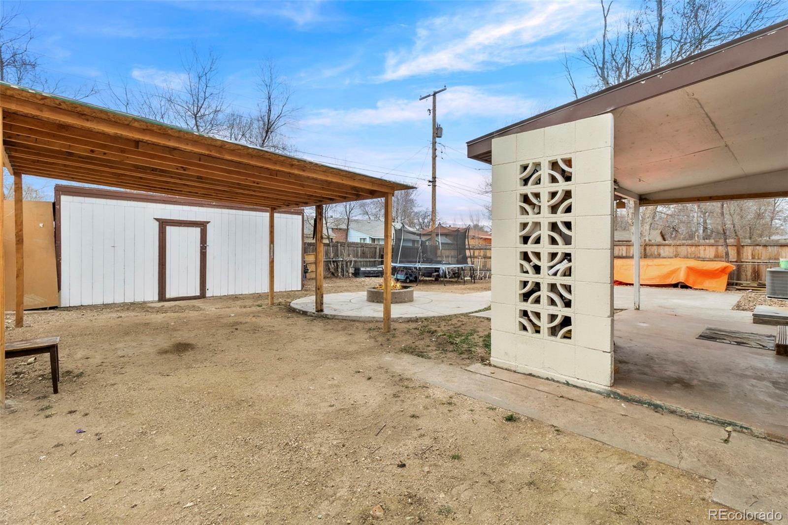505 26th Avenue Greeley, CO 80634 - Photo 16 of 18 a view of a backyard with garage