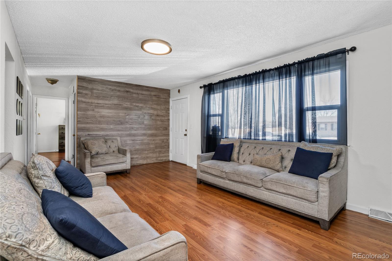 505 26th Avenue Greeley, CO 80634 - Photo 7 of 18 a living room with furniture and a fireplace