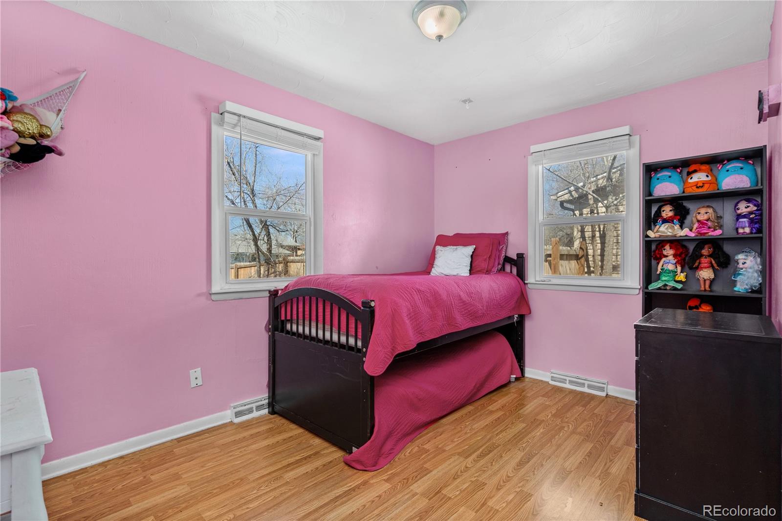 505 26th Avenue Greeley, CO 80634 - Photo 10 of 18 a bedroom with a bed and a window
