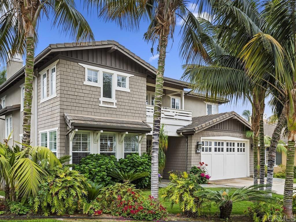 a view of a house with a palm tree