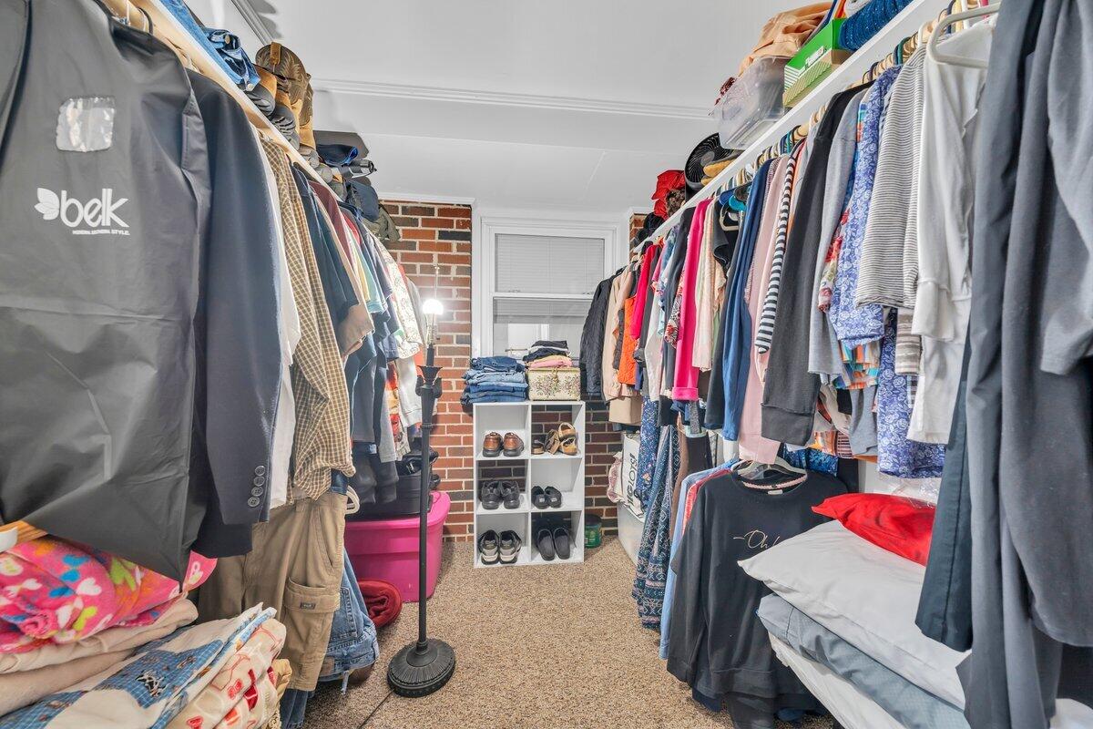 3226 Rakes Road Rocky Mount, VA 24151 - Photo 34 of 74 a view of walk in closet with clothes and shoes