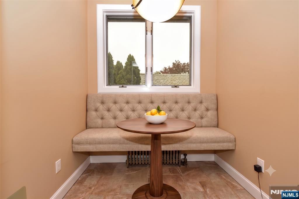 255 Pearsall Avenue Ridgewood, NJ 07450 - Photo 17 of 39 a view of a bathroom with a window and a table