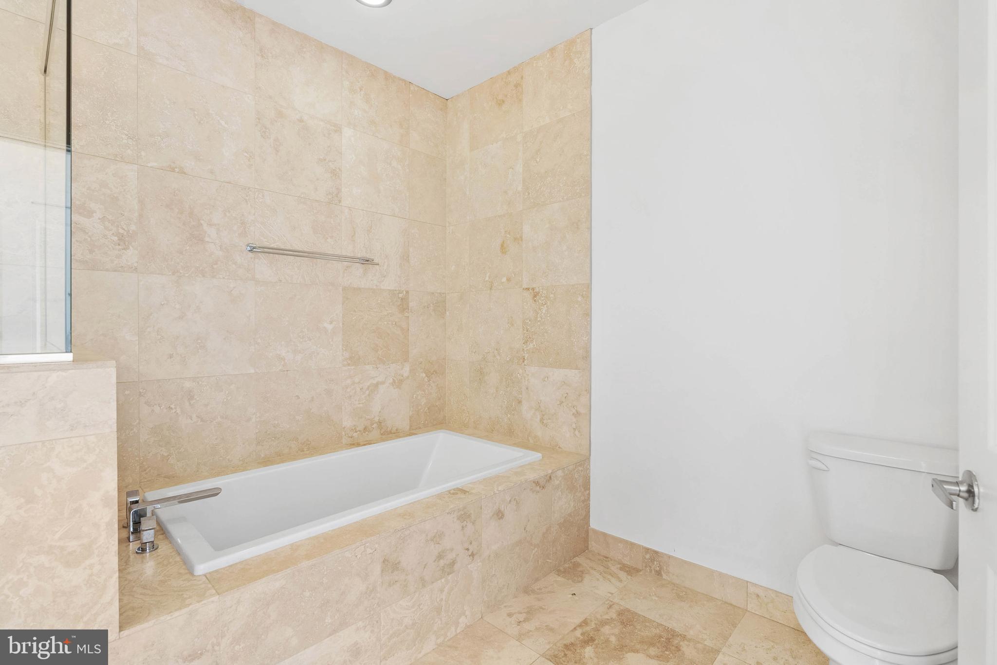 2103 East Susquehanna Avenue Philadelphia, PA 19125 - Photo 16 of 31 a bathroom with a tub and toilet