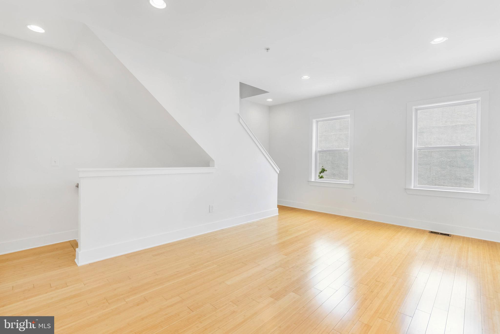 2103 East Susquehanna Avenue Philadelphia, PA 19125 - Photo 20 of 31 a view of an empty room with wooden floor and a window