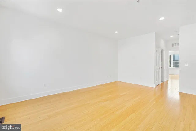 a bathroom with a sink mirror and toilet