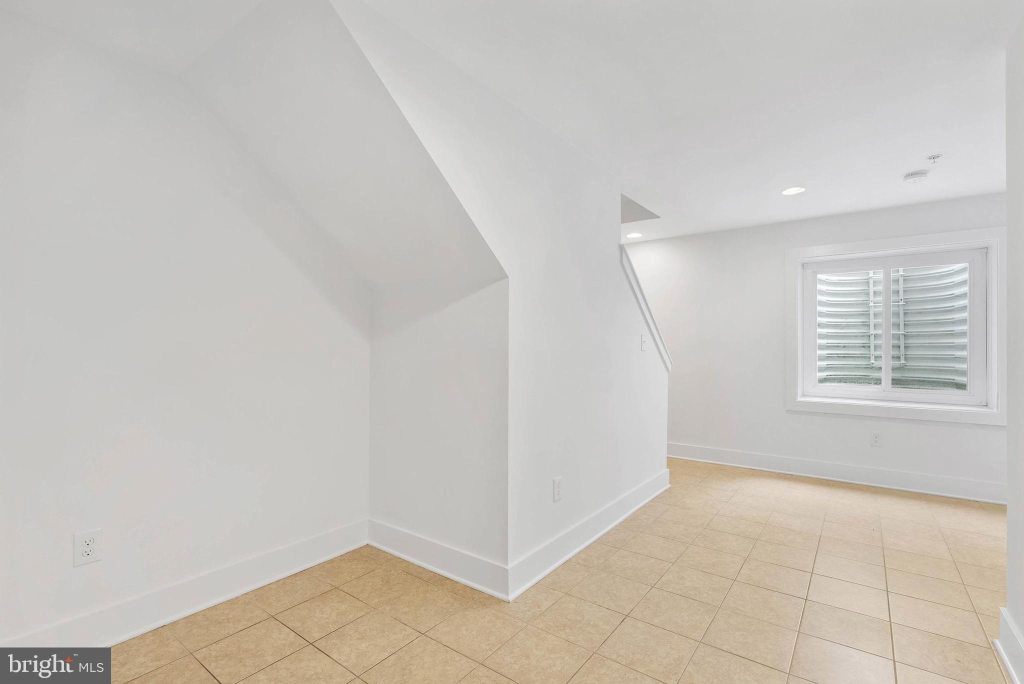 2103 East Susquehanna Avenue Philadelphia, PA 19125 - Photo 30 of 31 a view of an empty room with a window