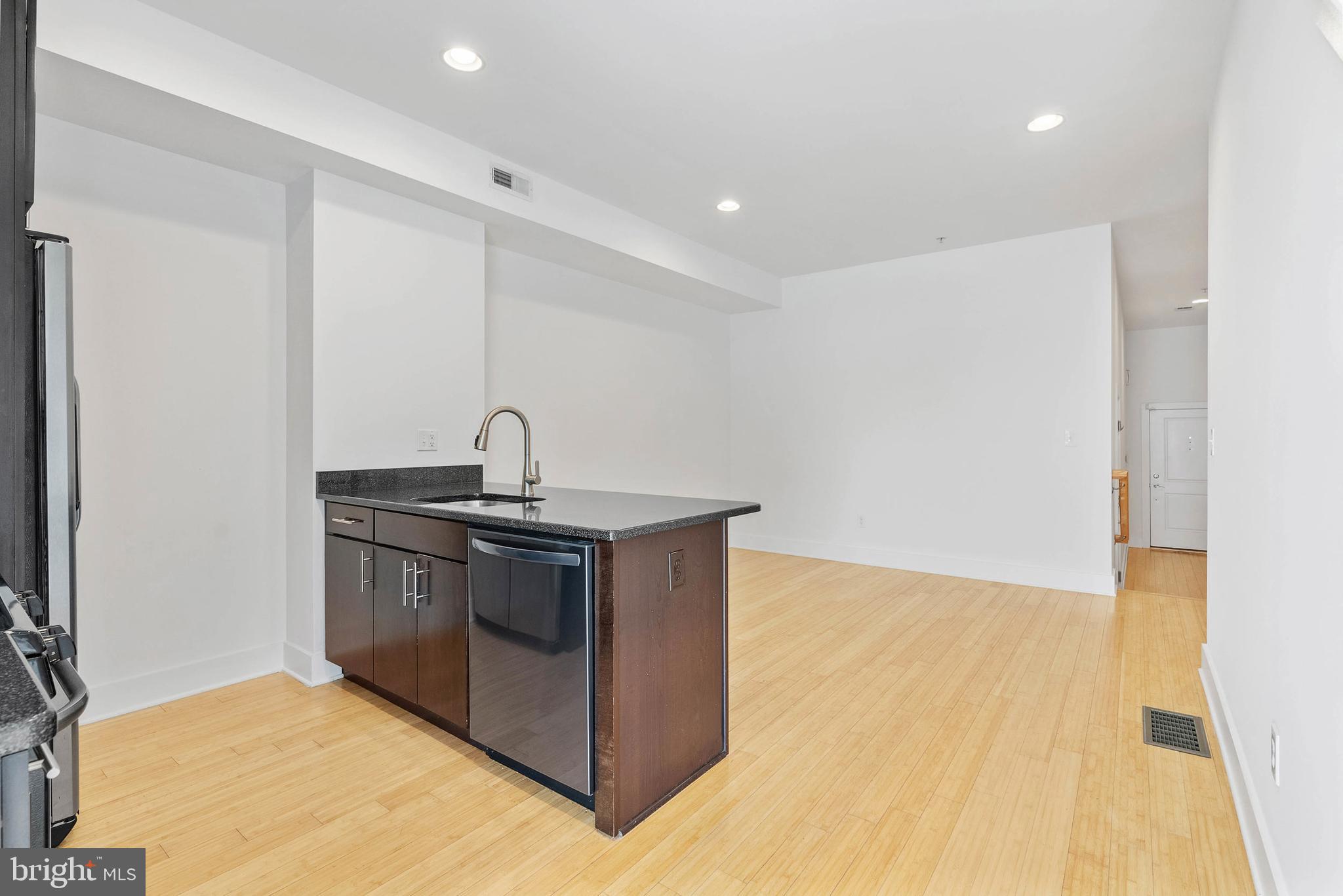 2103 East Susquehanna Avenue Philadelphia, PA 19125 - Photo 7 of 31 a kitchen with stainless steel appliances granite countertop a sink and a stove