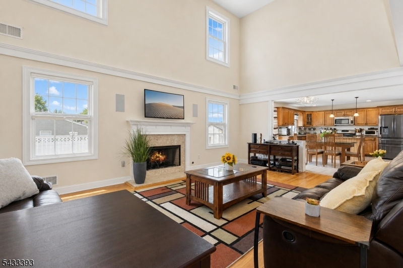 33 Stanton Street Clark, NJ 07066 - Photo 5 of 37 a living room with furniture and a fireplace