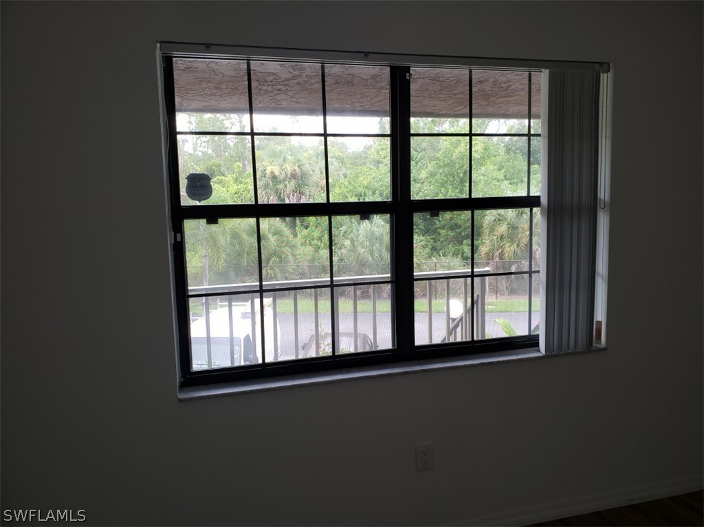 5313 Treetops Drive, Unit 202 Naples, FL 34113 - Photo 14 of 22 a view of an empty room with a window
