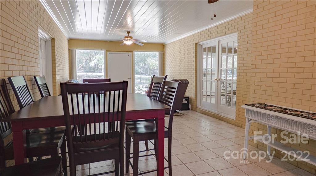 11128 Mallard Creek Road Charlotte, NC 28262 - Photo 13 of 47 a view of a dining room with furniture window and outside view