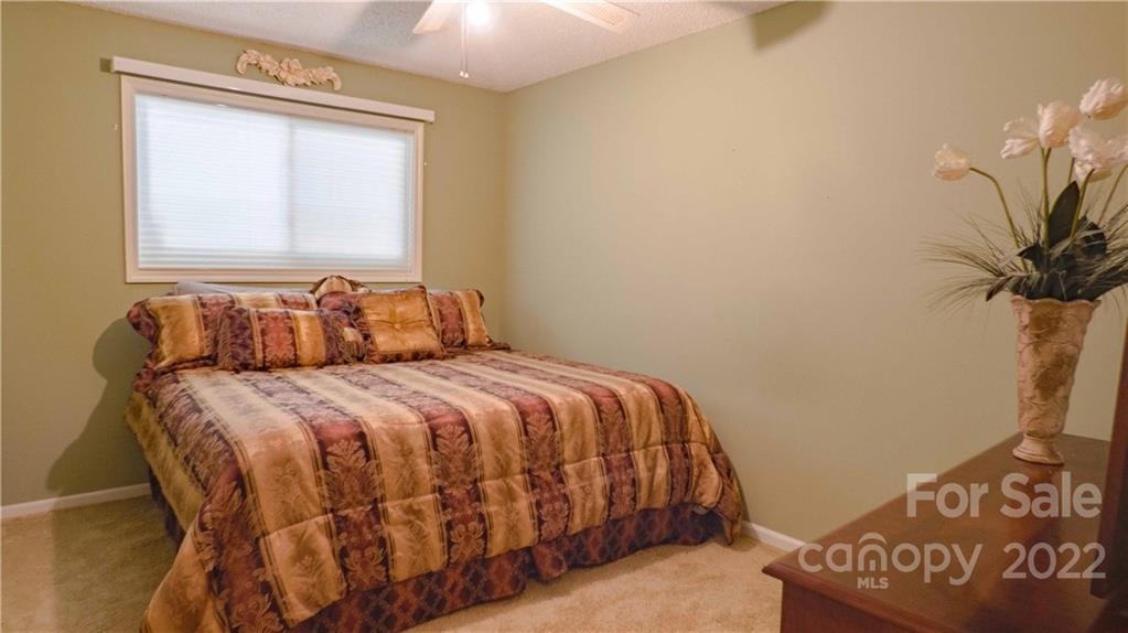 11128 Mallard Creek Road Charlotte, NC 28262 - Photo 16 of 47 a bedroom with a bed and a window