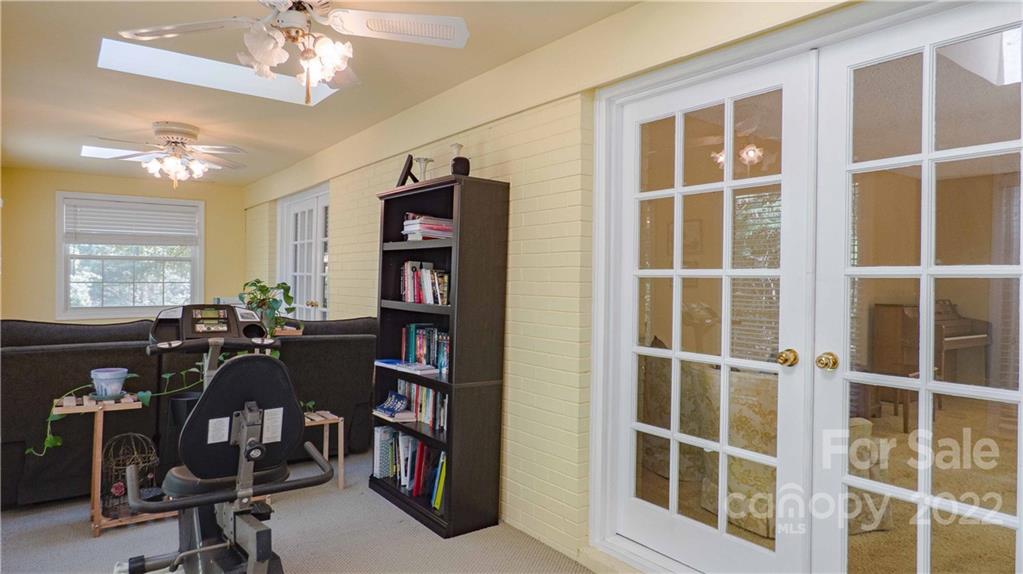 11128 Mallard Creek Road Charlotte, NC 28262 - Photo 20 of 47 a view of a workspace with furniture and a window