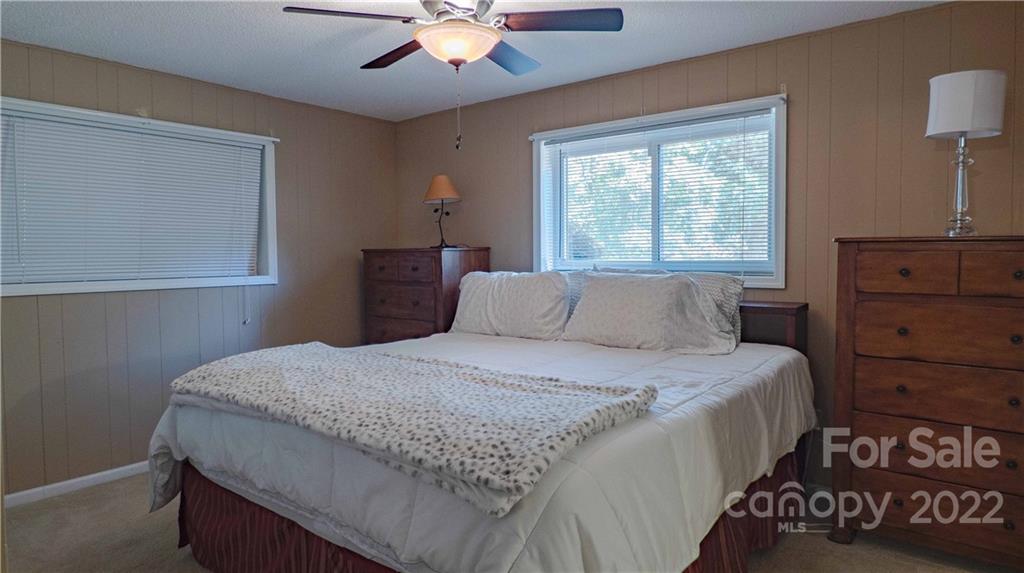 11128 Mallard Creek Road Charlotte, NC 28262 - Photo 29 of 47 a bedroom with a bed and a dresser