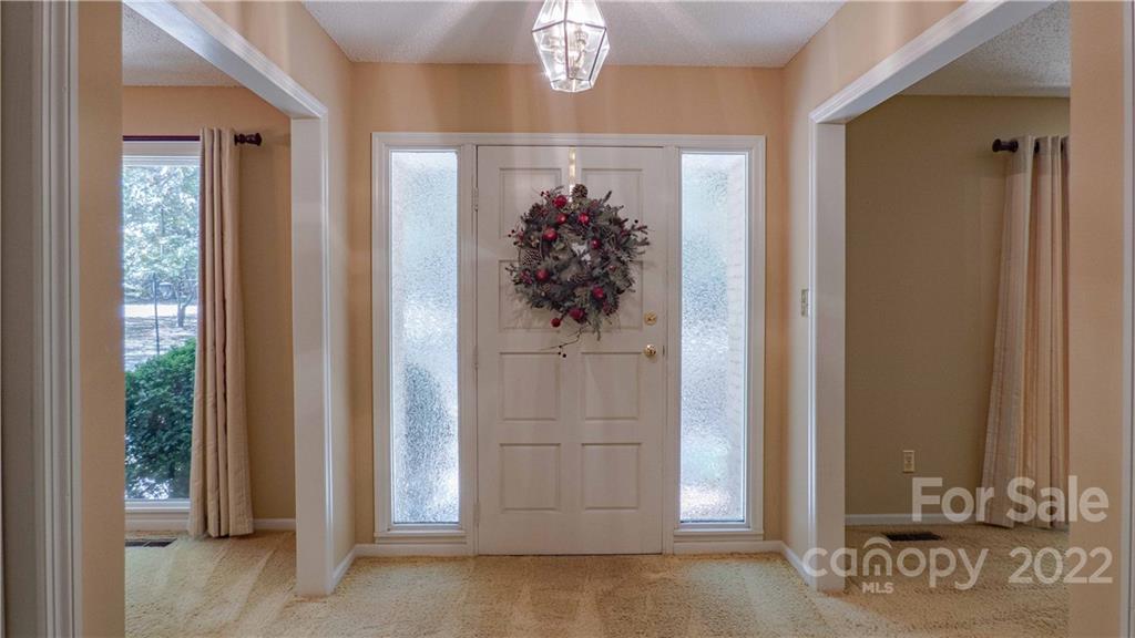 11128 Mallard Creek Road Charlotte, NC 28262 - Photo 3 of 47 a view of a hallway with wooden floor