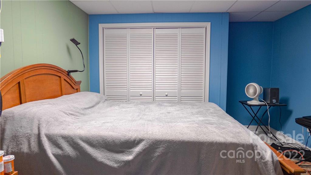 11128 Mallard Creek Road Charlotte, NC 28262 - Photo 31 of 47 a bedroom with a bed and a dresser next to a window