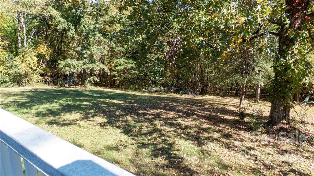 11128 Mallard Creek Road Charlotte, NC 28262 - Photo 40 of 47 a view of a field with trees
