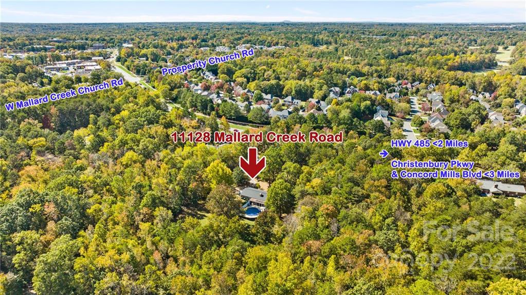 11128 Mallard Creek Road Charlotte, NC 28262 - Photo 47 of 47 an aerial view of residential houses with outdoor space
