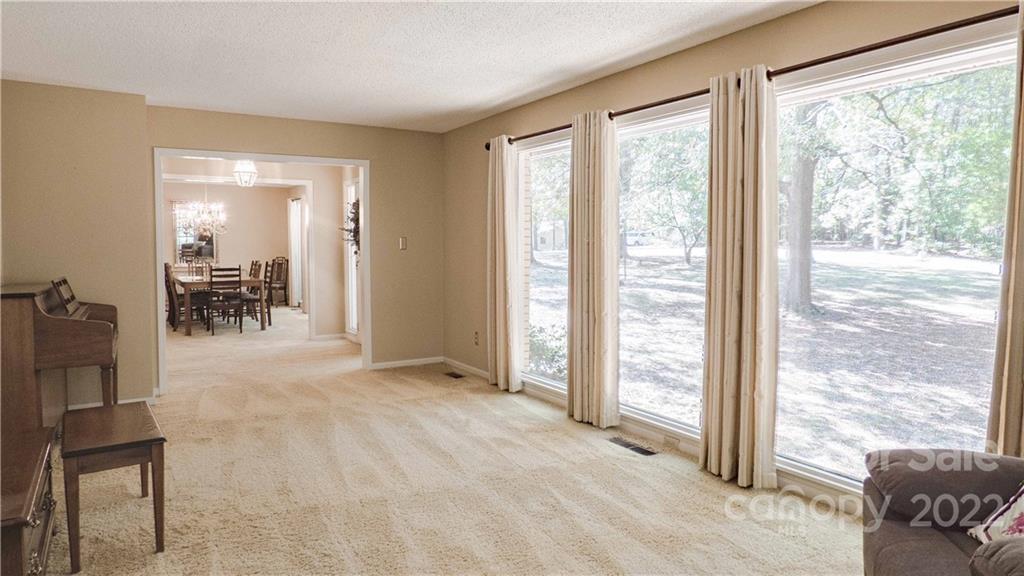 11128 Mallard Creek Road Charlotte, NC 28262 - Photo 5 of 47 a view of livingroom with furniture and floor to ceiling window
