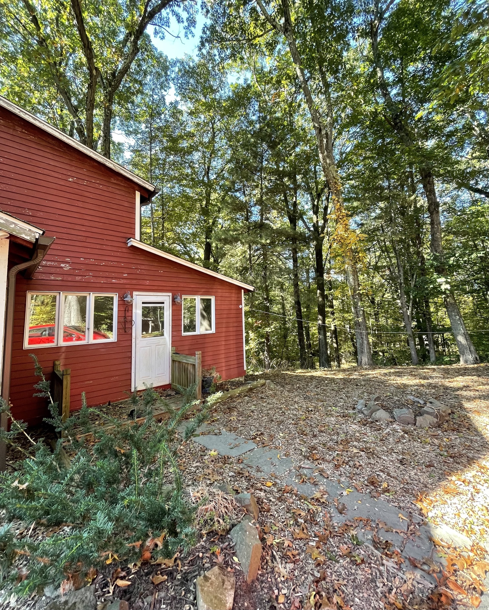 1142 Sperry Road Cheshire, CT 06410 - Photo 1 of 16 a front view of a house with yard and trees around