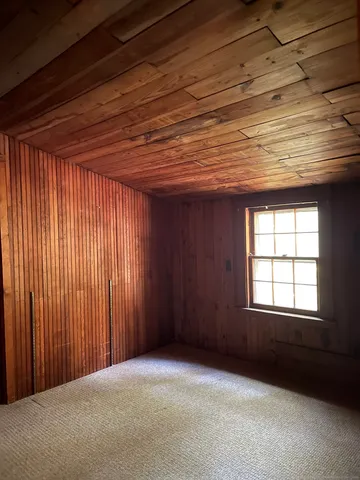 a view of a room with large windows