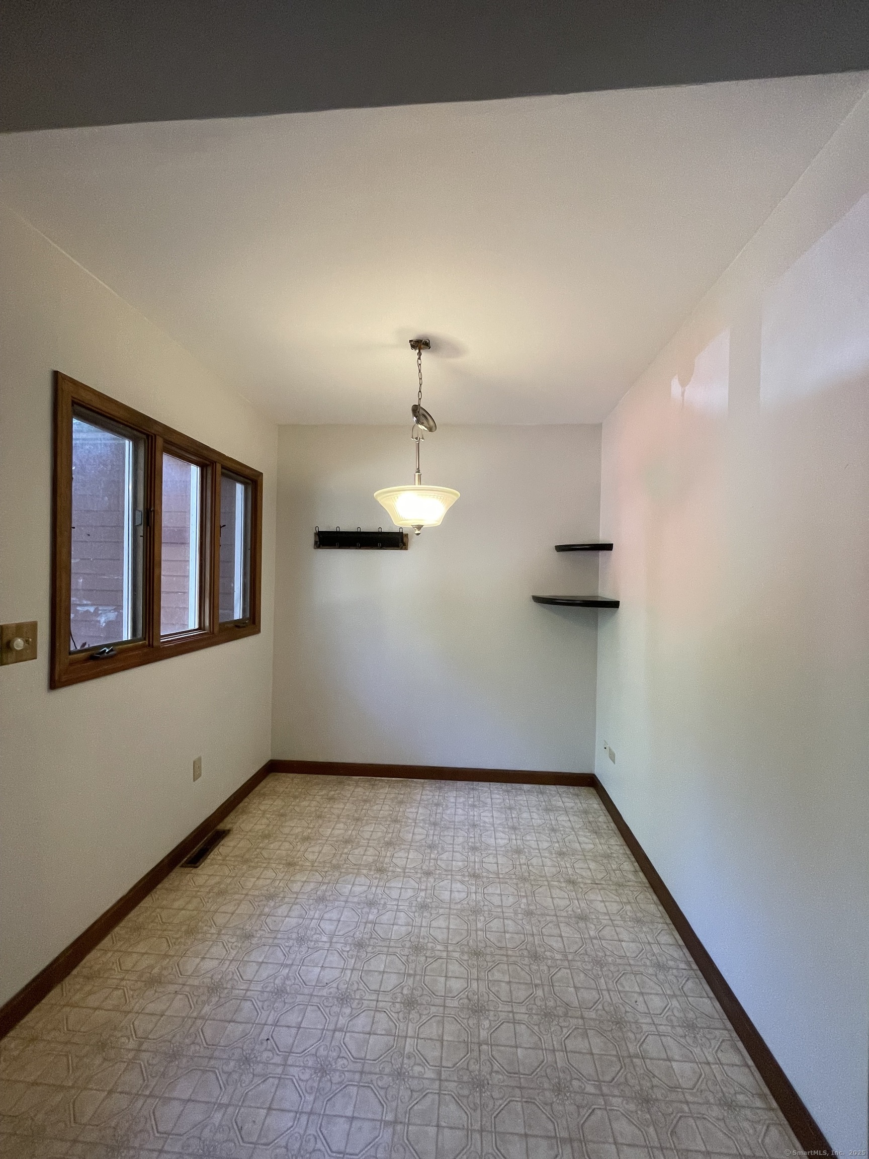 1142 Sperry Road Cheshire, CT 06410 - Photo 3 of 16 a view of an empty room with a window