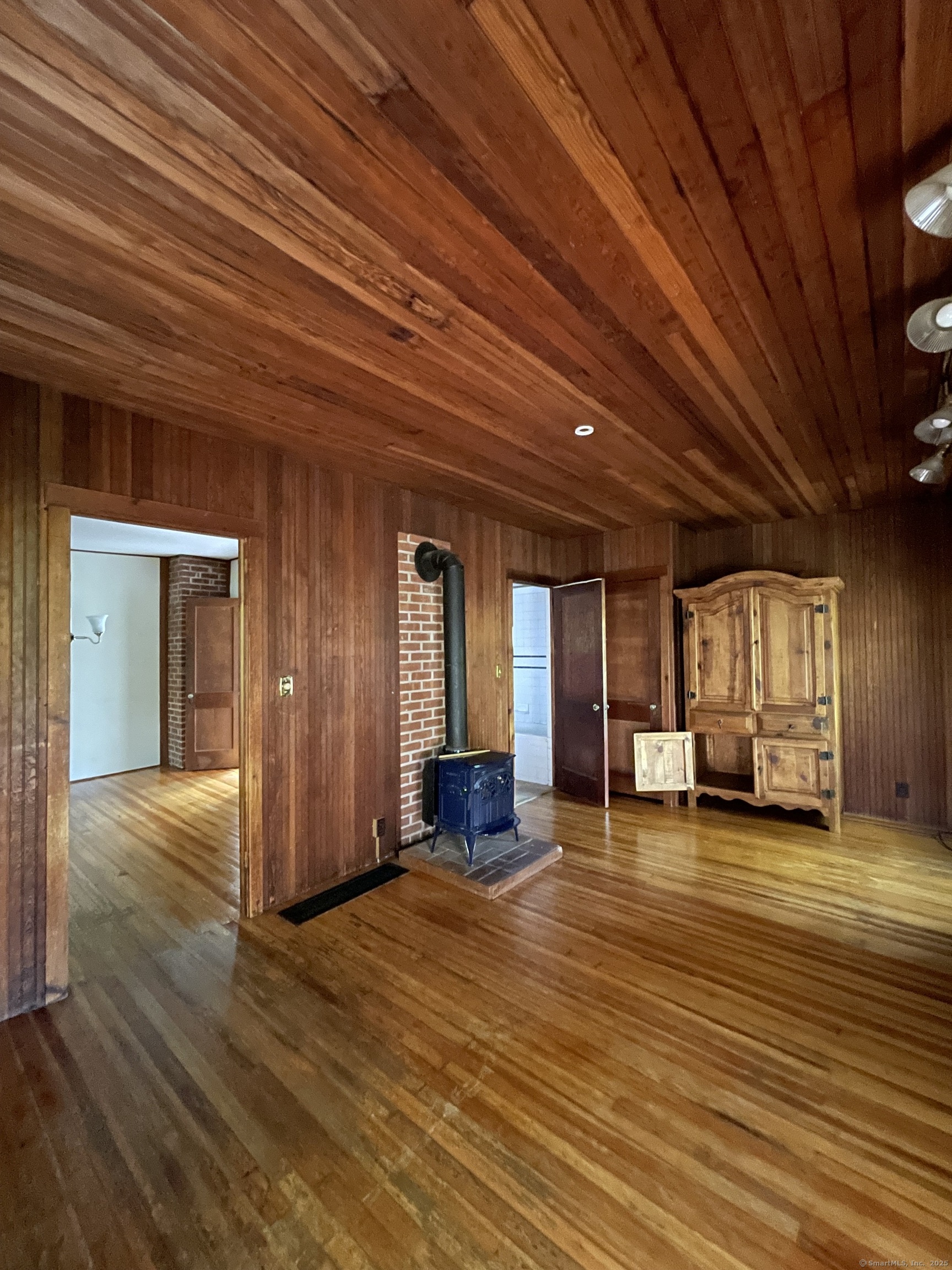1142 Sperry Road Cheshire, CT 06410 - Photo 5 of 16 a view of a livingroom with wooden floor and furniture
