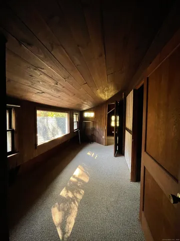 a view of a livingroom with furniture and windows