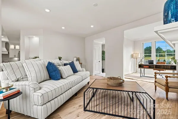 a living room with furniture and a table