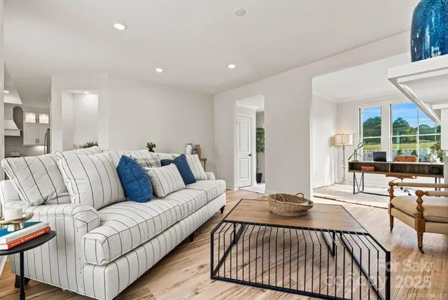 a living room with furniture and a table