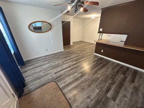 a view of an empty room with a window