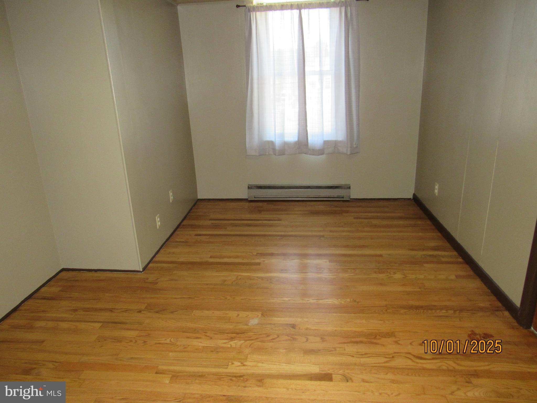 3290 Zion Road Bellefonte, PA 16823 - Photo 8 of 11 an empty room with wooden floor and windows