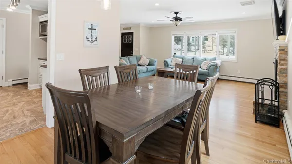 a view of a dining room with furniture window and wooden floor