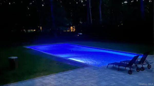 a view of a yard with a table and fire pit