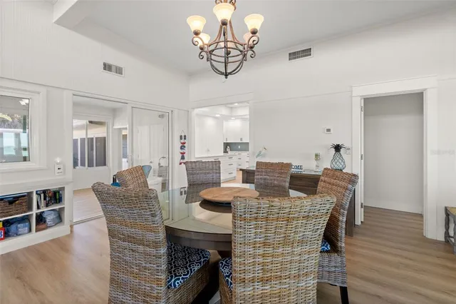 a living room with furniture a rug and a flat screen tv
