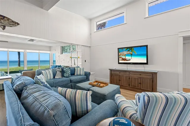 a bedroom with a bed closet and a large window